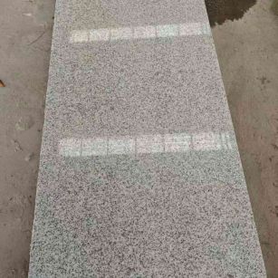 昭通芝麻白光面毛板